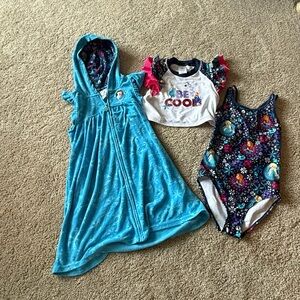 Frozen (Disney) set from the Disney store. Size 9/10. Swimsuit,coverup,sunshirt
